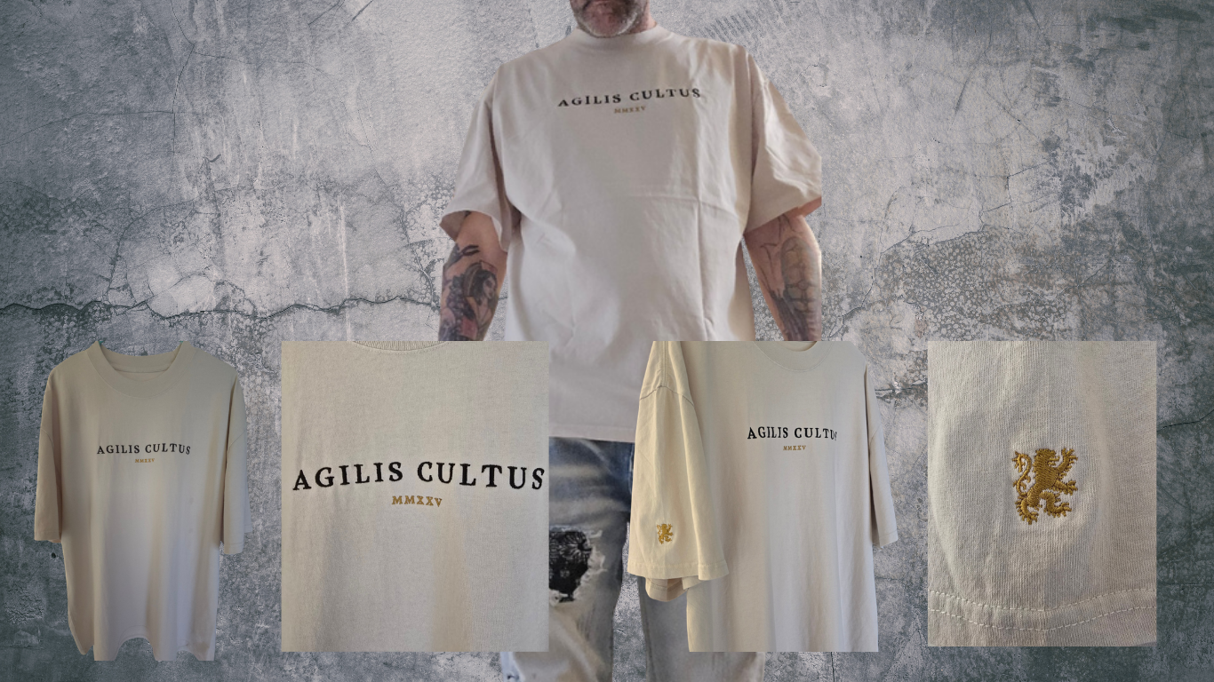 male model wearing beige AC Agilis Cultus oversized t shirt with minimalist front logo, textured wall background, modern identity streetwear