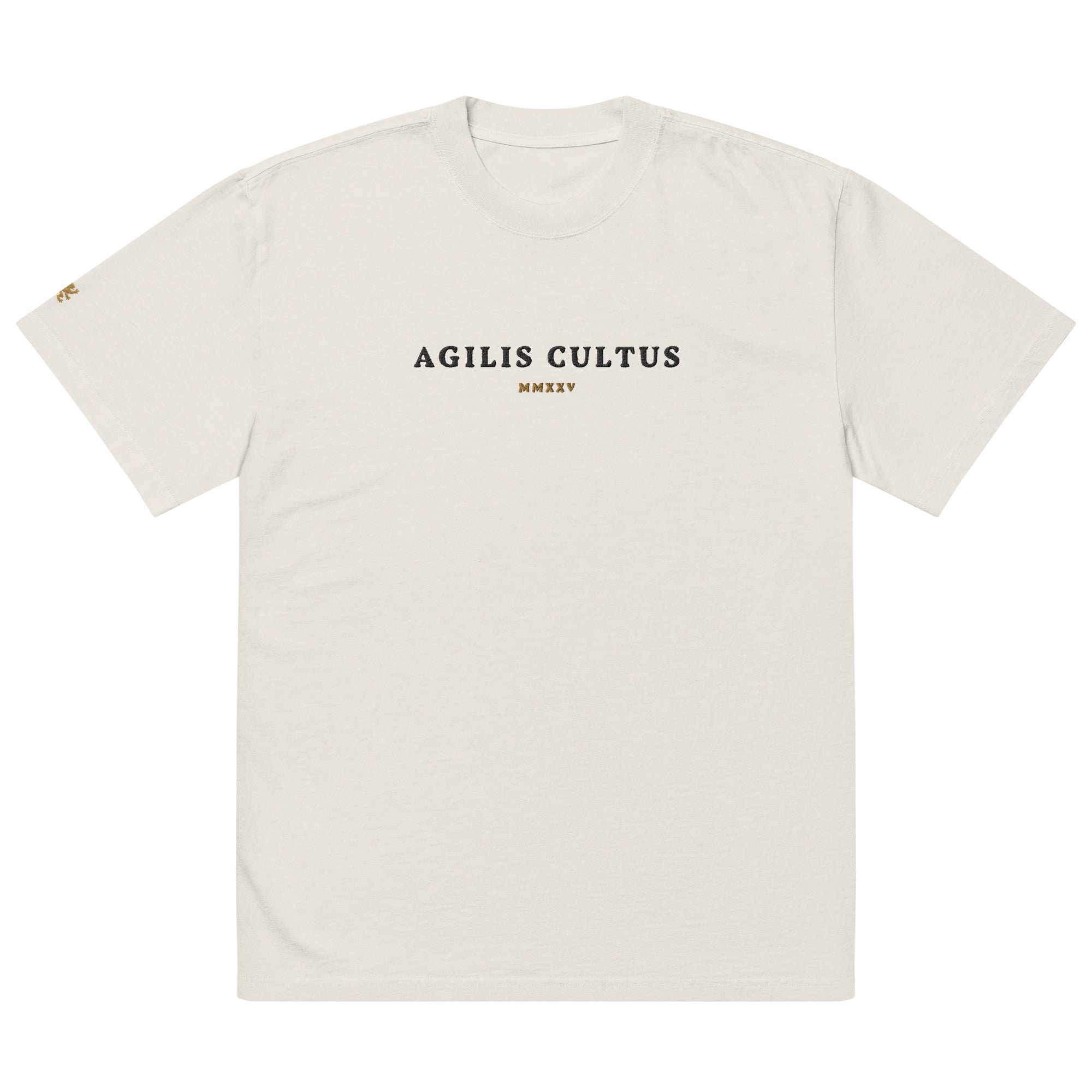 AC Agilis Cultus oversized heavyweight t-shirt in cream with black “Agilis Cultus” chest print and gold MMXXV detail, front view, boxy fit with dropped shoulders and wide ribbed collar, premium garment-dyed cotton streetwear tee