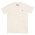 Essential Tee in natural — front view, soft unisex fit with embroidered lion crest