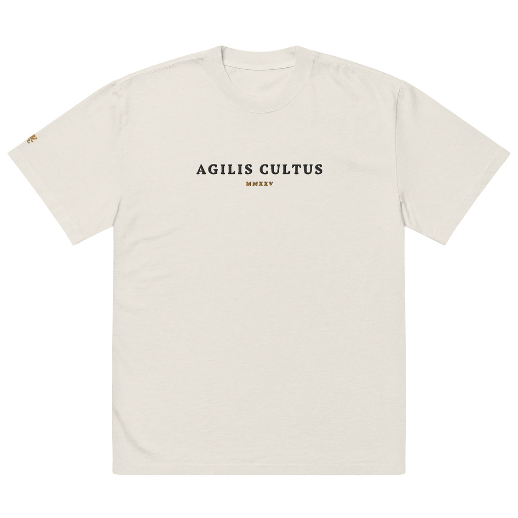 AC Heavyweight Oversized Tee in faded bone — garment dyed 100% carded cotton, boxy fit with dropped shoulders and embroidered Celtic crest, by Agilis Cultus